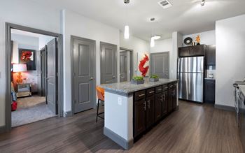 A kitchen with a large island in the middle of it